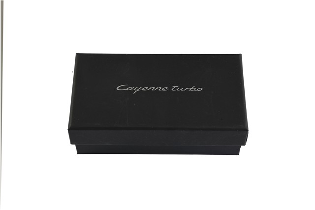 Porsche Cayenne Turbo Coupé – model car, 1:43 scale / paperweight, in Lava Orange